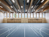 The walls and ceiling of the gym are made of wood