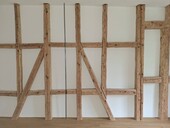 Half-timbered walls inside and outside dominate the structural design.